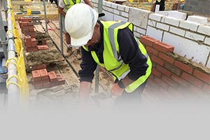 construction worker using social distancing device