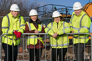 Workers at the site of NE homes