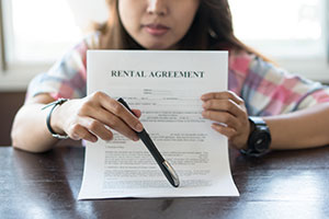 A landlord with a tenant's agreement during the Covid 19 outbreak